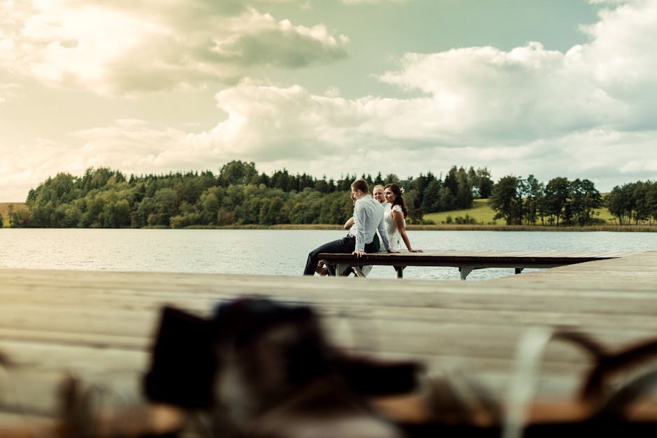Couple watching sunset Lake Como pier