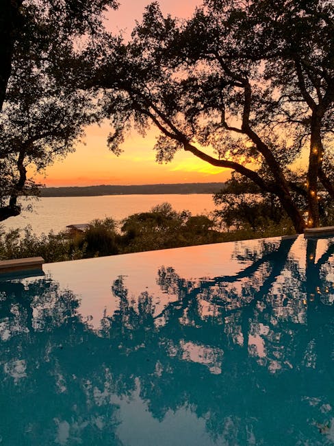 Outdoor infinity pool overlooking lake