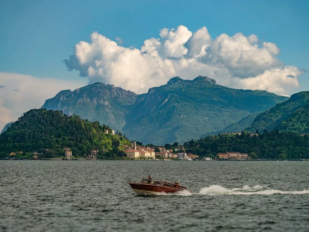 Menaggio lakeside ferry pier with mountains